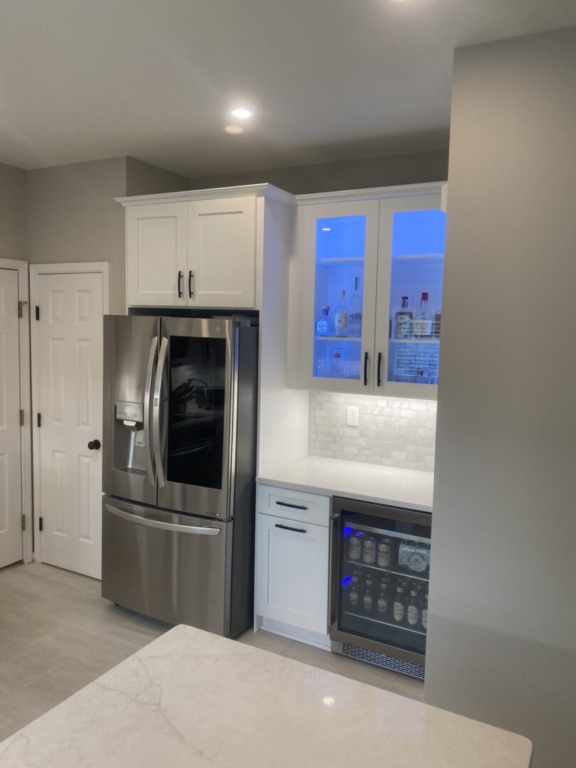 A modern kitchen with white refrigerator